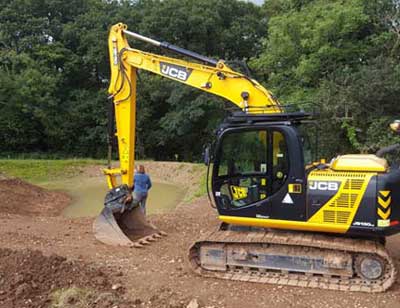 A tiltrotator is ideal for creating landscape features such as ponds